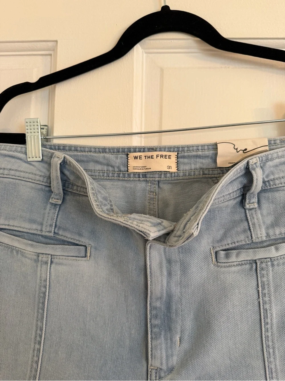 Free People High-Rise Light Wash Jeans with Pink Star Patches